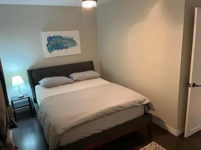a small bedroom with a bed in a room at 3 BDR lake Simcoe cottage-free parking -day pass to provincial park-one hour from Toronto in Georgina