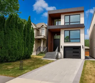 a house with a driveway in front of it at Luxury 1BR plus den walkout basement in Toronto