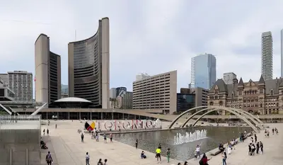 a group of people walking around in a city at Cozy & Elegant Condo-Lake & City View-35th floor in Toronto