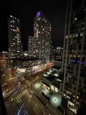 a view of a city at night with tall buildings at Fully furnished Lux 1bedroom condo in Toronto