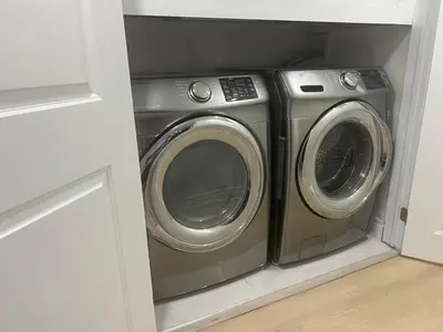 a washer and dryer in a laundry room at Bachelor Suite Near Transit - Private Stay in Toronto Registration number STR-2503-FSHPPQ in Toronto