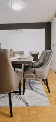 a dining room with a table and leather chairs at Luxury 3BR Near Pearson Airport Free Parking in Toronto