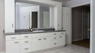 a bathroom with a sink and a mirror at Muskoka 4-Bedroom Cottage in Port Carling
