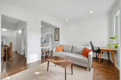 a living room with a couch and a table at 1 Bed Suite Steps to Bloor in Toronto