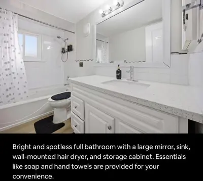 a bathroom with a sink and a toilet and a mirror at Renovated 4-Bedroom Upper-Unit Detached House 5 Beds Near Toronto Pearson Airport in Toronto