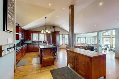 a kitchen with a island in the middle of a room at Main House in Wasaga Beach