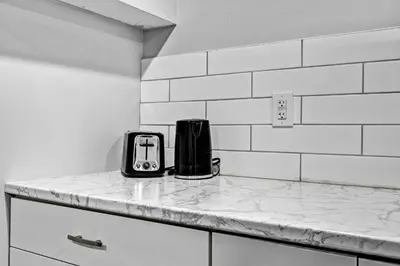 a toaster sitting on top of a counter in a kitchen at NEW 5 Bedroom House Near The Falls in Niagara Falls