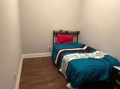 a bedroom with a bed and a red pillow at Entire Place With Pool Sauna in Vaughan
