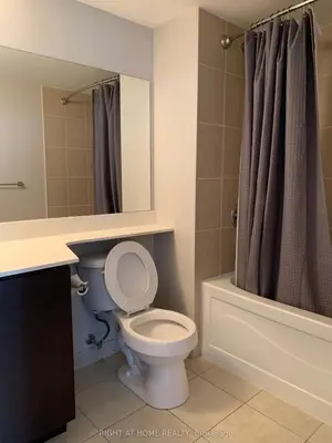a bathroom with a toilet and a sink and a shower at Entire Place With Pool Sauna in Vaughan