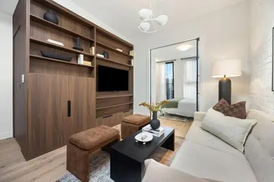 a living room with a couch and a table at The Brick Hotel - The Loft in Toronto