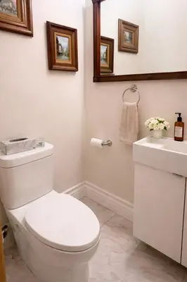 a white bathroom with a toilet and a sink at Luxury Forest Retreat Near Mansfield Ski Club in Mulmur