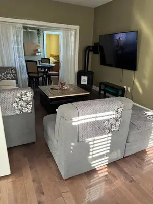 a living room with a couch and a table at Nature & Comfort - Private Manor in Innisfil
