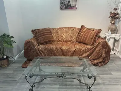 a living room with a couch and a glass table at Home Base Executive Rental in Hamilton in Hamilton