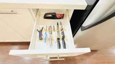a drawer full of knives in a cabinet at Newly Renovated Private Suite Separate Entrance in Richmond Hill