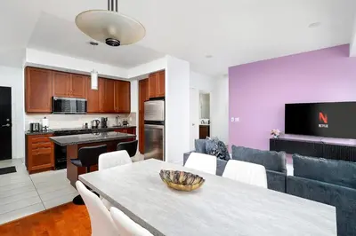 a kitchen and living room with a table and chairs at Comfort and Beauty in the heart of Tor | W Parking in Toronto