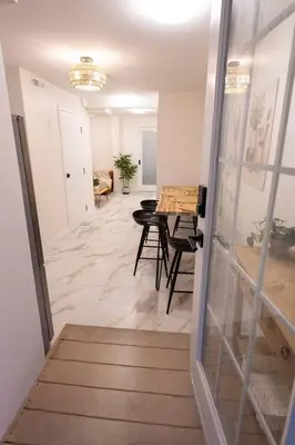 a hallway with a table and a dining room at Apartment Near Downtown Toronto & The Beaches in Toronto
