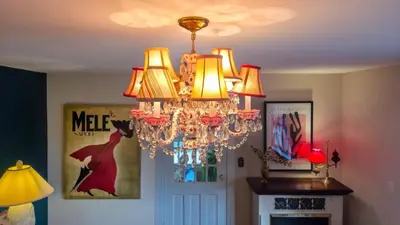 a chandelier hanging from a ceiling in a room at The Farmhouse Manor B&B in St. Catharines