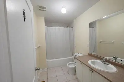 a bathroom with a sink and a toilet and a shower at Private & Spacious King-size Bedroom with 3 Bath access! Brampton Shared Home with Full Kitchen, WiFi, Laundry & Backyard Deck! Near Mount Pleasant GO, Ideal for Work Trips, Long Stays & Solo Travelers! in Brampton