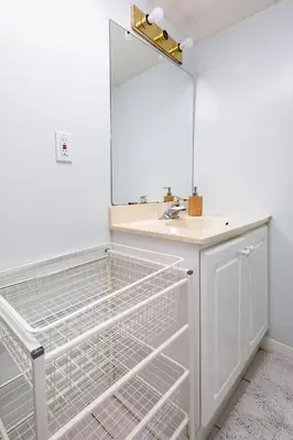 a bathroom with a sink and a mirror at Roomy 1BD Apartment in Basement of House in Mississauga