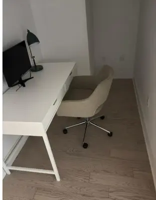 a white desk with a chair and a lamp at Nice view apartment office den in Port Hope