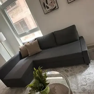 Condo with grey sofa bed