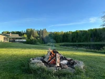 a fire pit in the middle of a field at Cajun Cabin Private Nature Resort in Minden