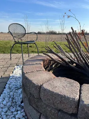 a bench sitting on top of a stone wall at Deluxe Country Escape-Entire Basement Unit in Hamilton