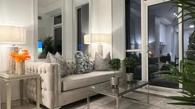 a living room with a couch and a table at Prestige Upper Series 1-Bedroom Condo at Vaughan Metropolitan Centre in Vaughan