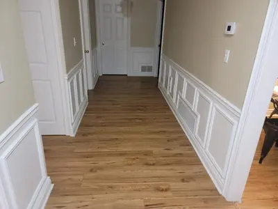 an empty hallway with wood floors and white walls at Spacious Bright Home In Woodbridge in Vaughan