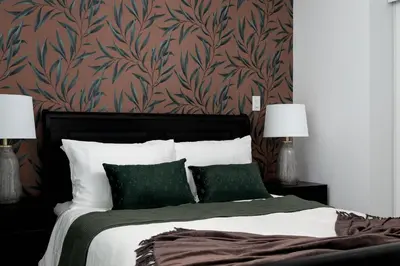 a bedroom with a large bed with green pillows at Live the excitement Stay next to Scotiabank Arena! in Toronto