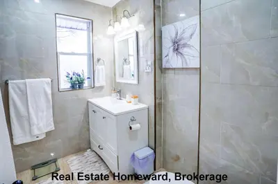 a bathroom with a sink and a shower at 132 chatham ave in Toronto