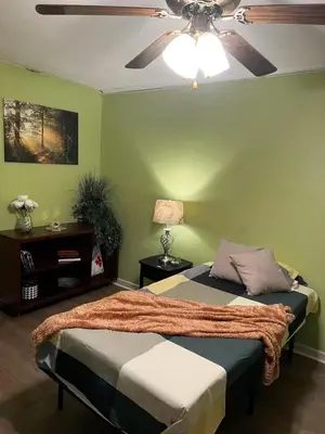 a bedroom with a bed and a ceiling fan at House near University of Waterloo, Perimeter Institute, Wilfred Laurier University in Waterloo