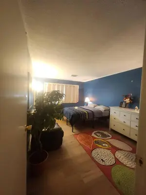a bedroom with a bed and a potted plant at House near University of Waterloo, Perimeter Institute, Wilfred Laurier University in Waterloo
