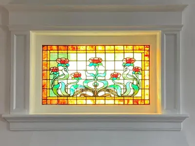a stained glass window with two cats on a wall at Warm, Stylish Edwardian Escape in Downtown Meaford in Meaford