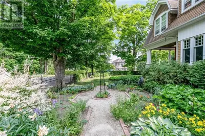 a garden in front of a house at Warm, Stylish Edwardian Escape in Downtown Meaford in Meaford
