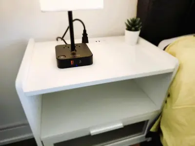 a white bedside table with a lamp on it at Toronto Lakeview by TMU & UofT with Pool, Gym & Parking in Toronto