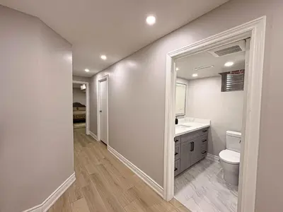 a bathroom with a white toilet and a sink at Blessed Home in Milton