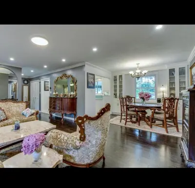 a living room with a couch and a table at Grimsby Lake Front Home in Grimsby