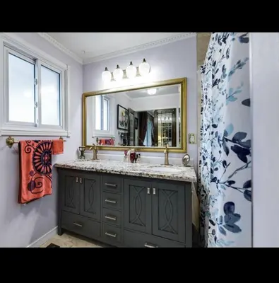 a bathroom with a sink and a mirror at Grimsby Lake Front Home in Grimsby