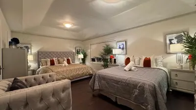 a bedroom with two beds and a couch at Executive Luxury Stay Corporate Paradise in South Richvale in Richmond Hill