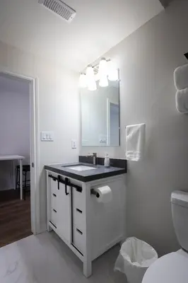 a white bathroom with a sink and a mirror at Cozy Cove Retreat, Private Suite Near Friday Harbour, Barrie & Lake Simcoe in Innisfil