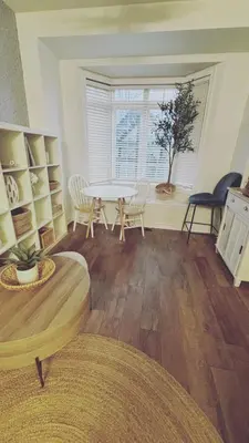 a living room with a table and chairs and a window at Grimsby on the Lake sweet, your perfect retreat in Grimsby