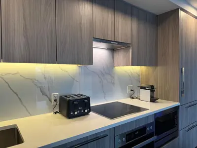 a kitchen with a sink and a counter top at Luxury Condo Downtown Toronto in Toronto