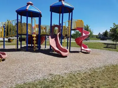 a playground with several slides and a slide at Prime Waterfront Cottage on Sandbanks Area Resort in Cherry Valley
