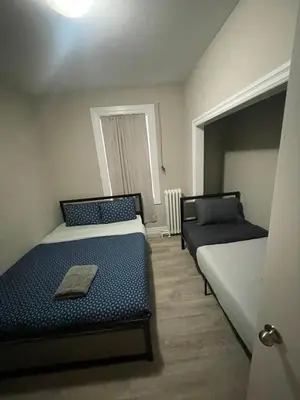 a room with two beds and a window at Central Signature Stay Downtown-Direct Transit to BMO Field Union & Free Wifi in Toronto