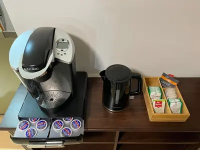 a coffee maker sitting on a counter next to a box at Cozy Private Room with Shared Bathroom in Toronto in Toronto