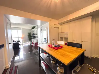 a kitchen with a wooden counter top in a room at CityPlace Lofts Free Parking in Toronto