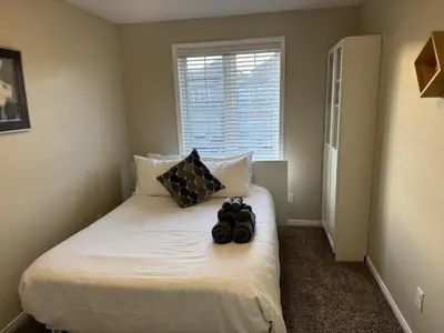 a bedroom with a bed with two balls on it at Gorgeous 3-Bedroom 3Bathroom house in Kitchener
