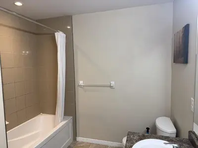 a bathroom with a shower and a toilet and a sink at Gorgeous 3-Bedroom 3Bathroom house in Kitchener