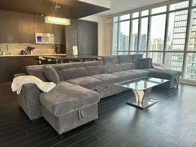 a living room with a couch and a table at Dreamspace 3 Bdrms with 1 Parking in Toronto